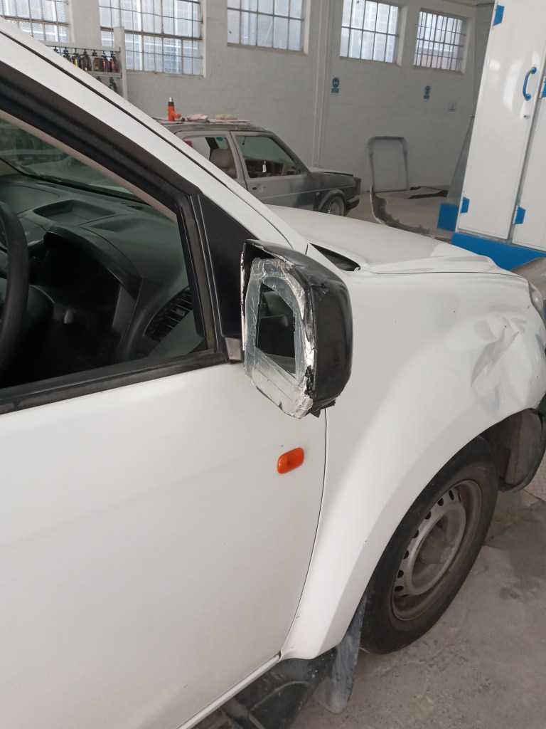 Black car in Padres spray booth